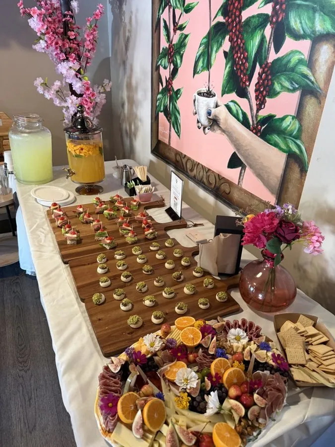 A spread of appetizers, deviled eggs, cheese and fruit at an ICONS Coffee & Connections event